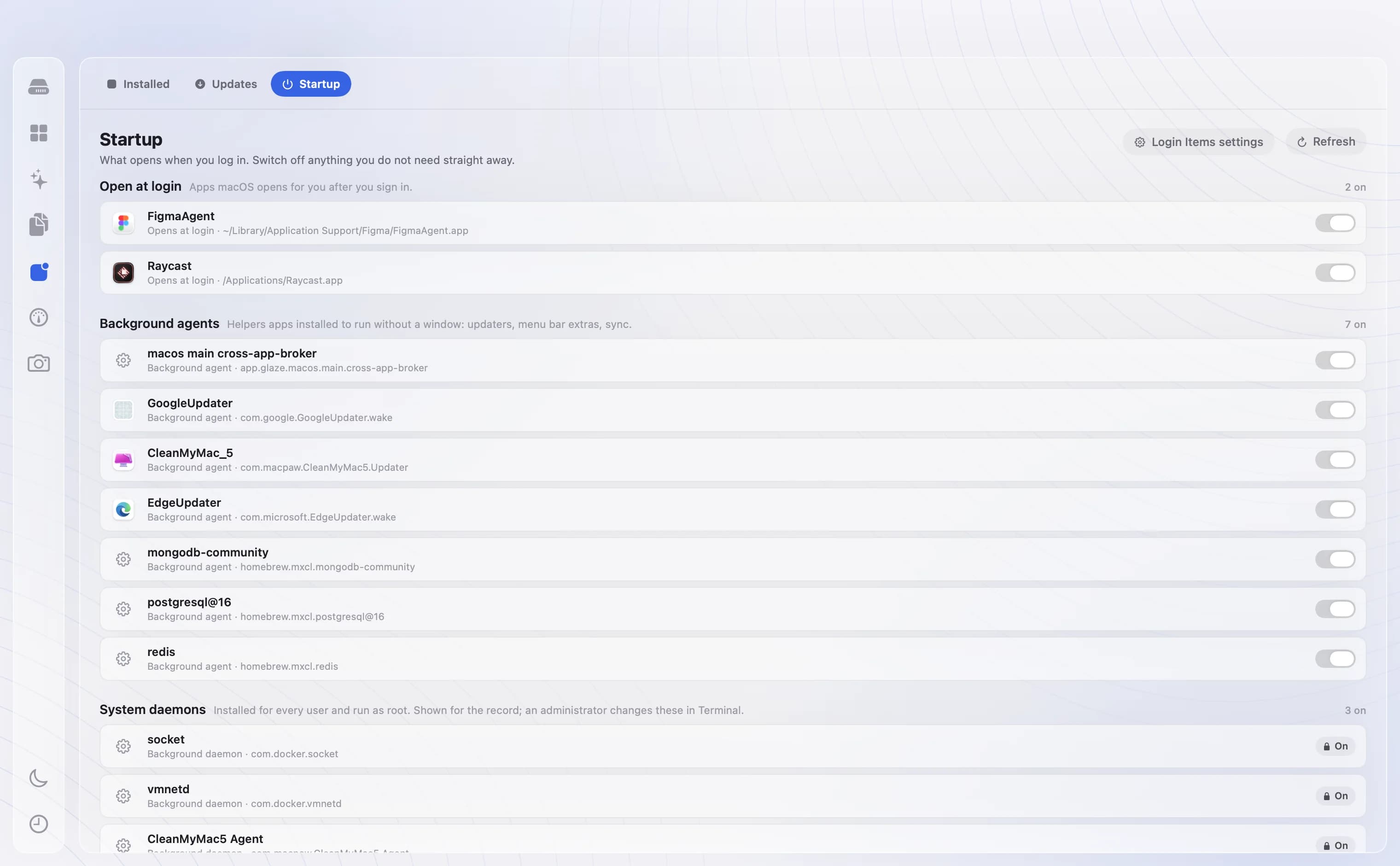 DiskBuddy Applications Startup tab listing login items and background agents with switches.